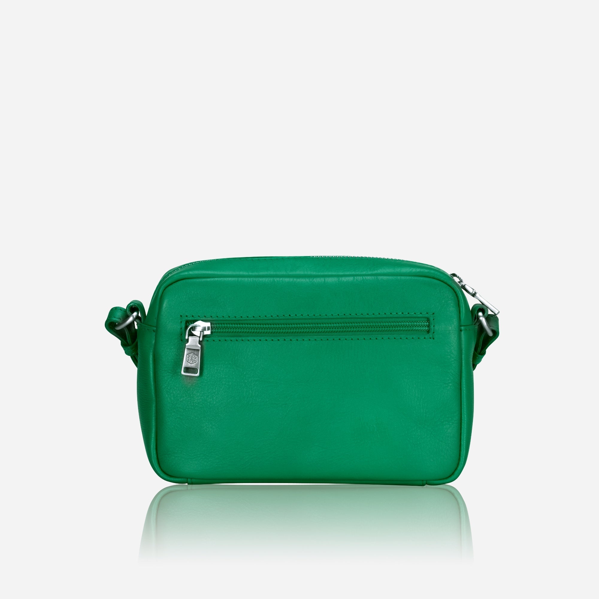Small Crossbody bag in Spring Basil color with vibrant lining, showcasing its sleek design and spacious interior.