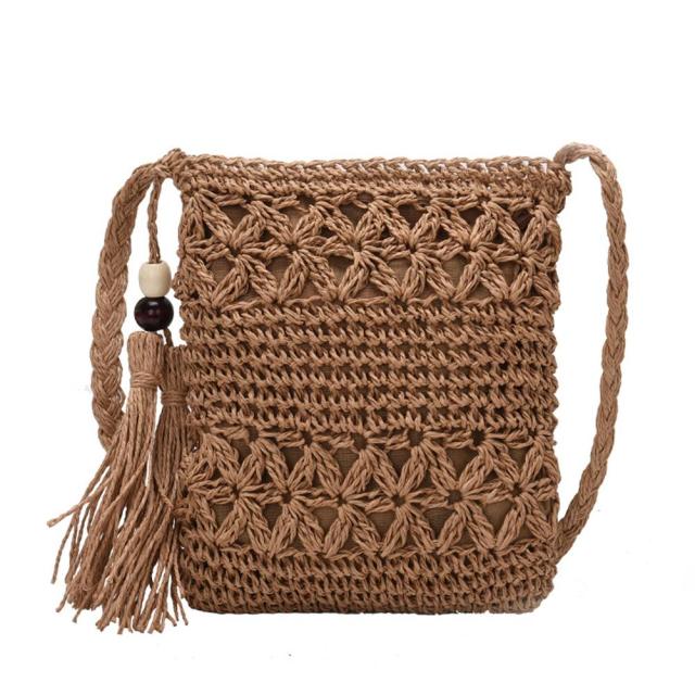 Small Straw Summer Crossbody handbag featuring a tassel and patchwork design, perfect for summer outings.