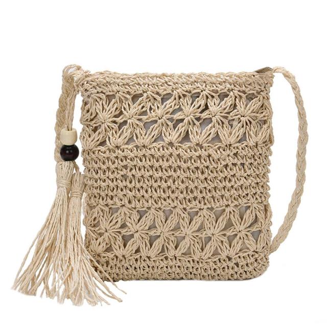 Small Straw Summer Crossbody handbag featuring a tassel and patchwork design, perfect for summer outings.