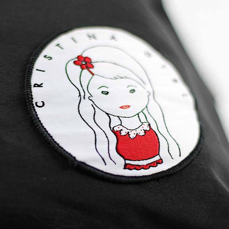 Soft polyester bag and backpack in four colors, featuring adjustable straps and zipped pockets.