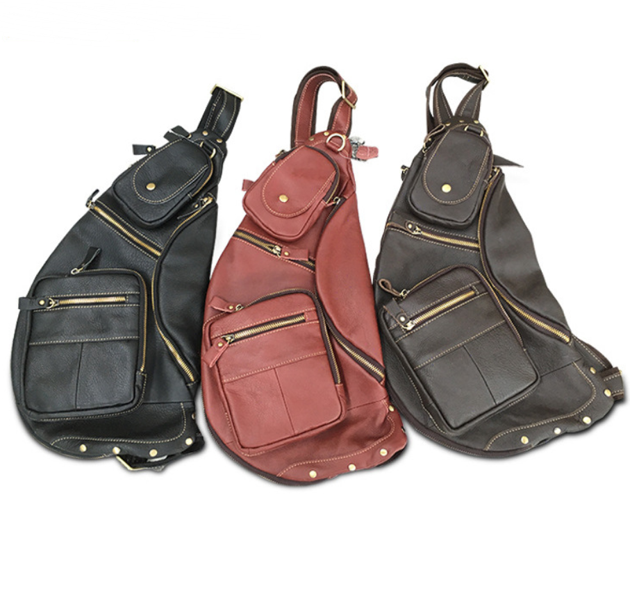 Solid Color Anti-theft Chest Bag for Men made of top layer cowhide, featuring multiple pockets and a zipper closure for security.