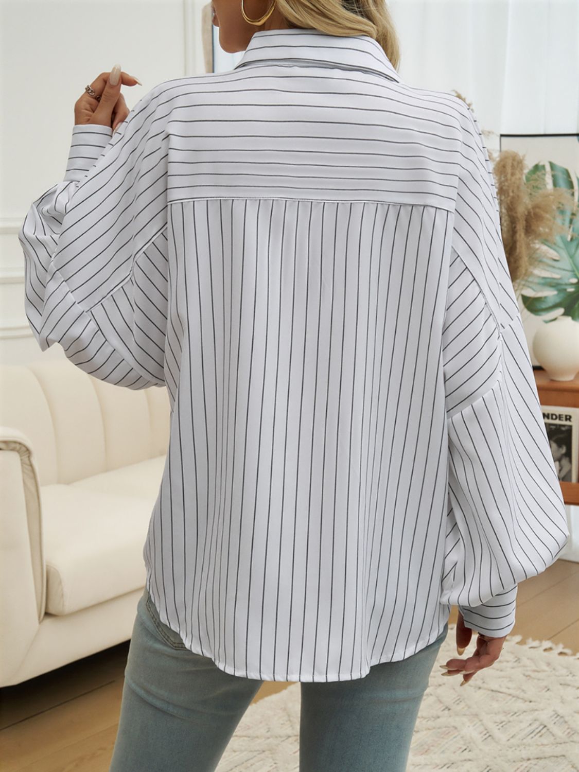 A stylish striped collared neck long sleeve shirt in a classic design, featuring buttoned front and pocket.