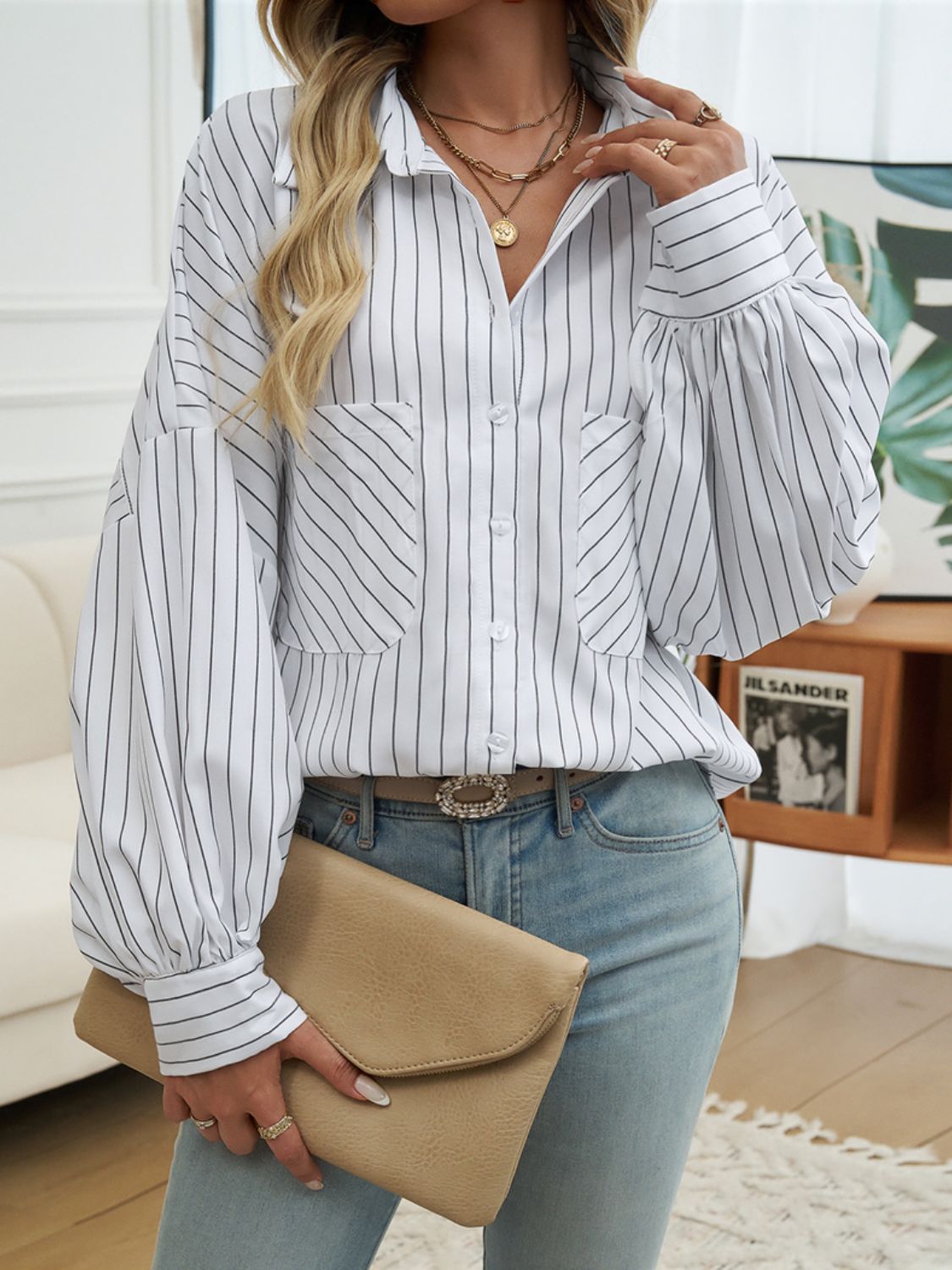 A stylish striped collared neck long sleeve shirt in a classic design, featuring buttoned front and pocket.