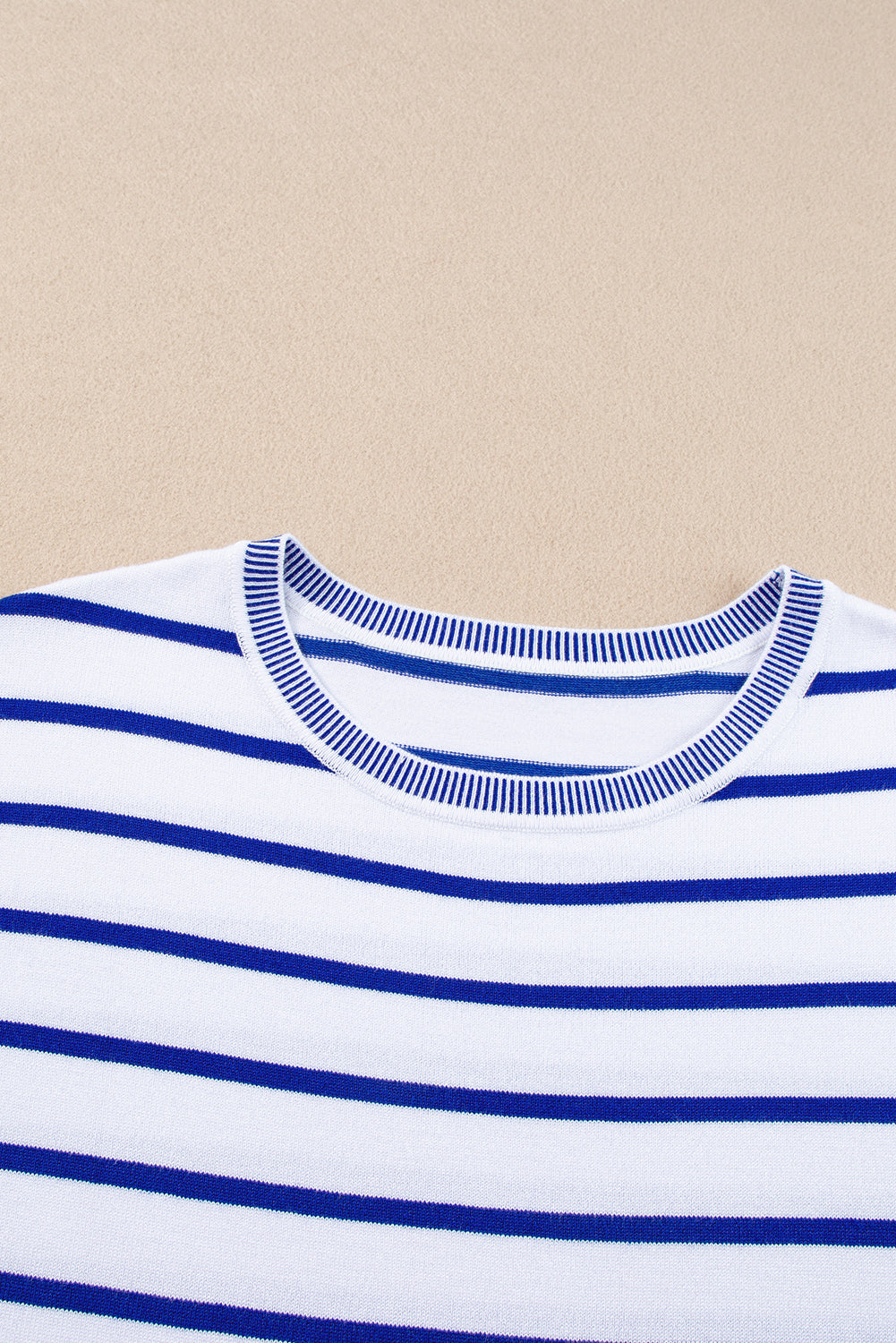 Striped round neck cap sleeve knit top in a stylish design, showcasing its soft fabric and comfortable fit.
