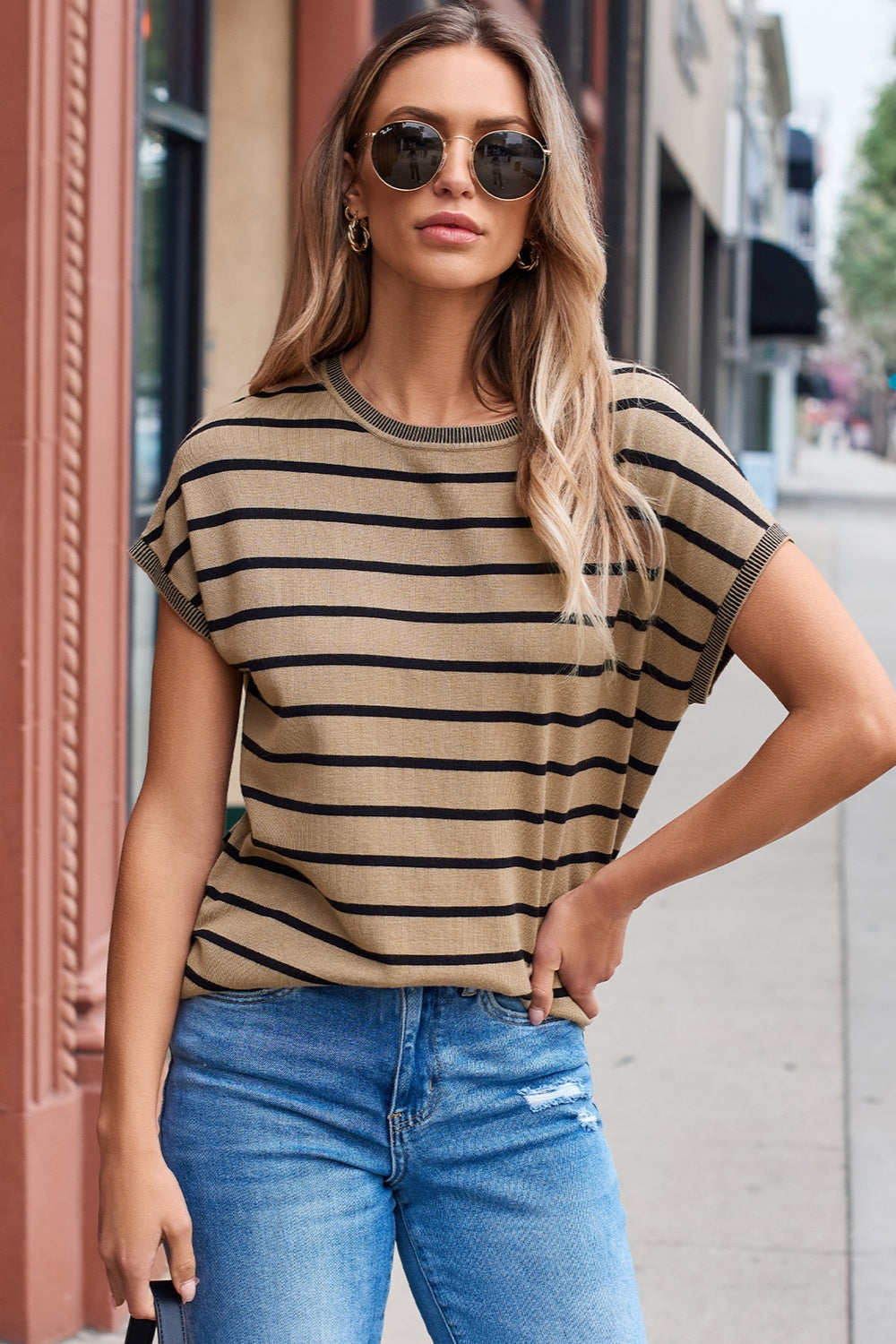 Striped round neck cap sleeve knit top in a stylish design, showcasing its soft fabric and comfortable fit.