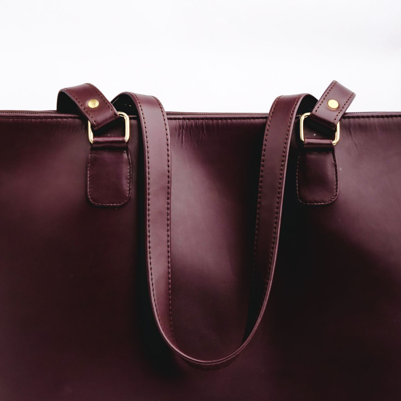 Boss Lady Pure Leather Women's Tote Bag in Wine Berry, showcasing its elegant design and spacious interior.