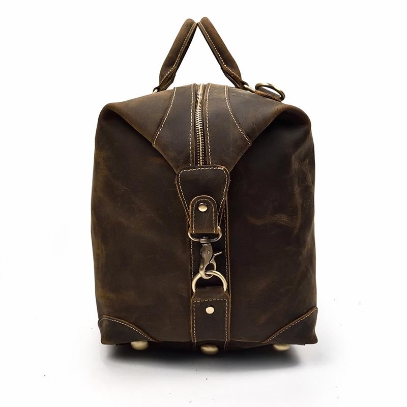 The Eira Duffle Bag made of premium crazy horse leather in two shades of brown, showcasing its spacious design and comfortable leather handles.