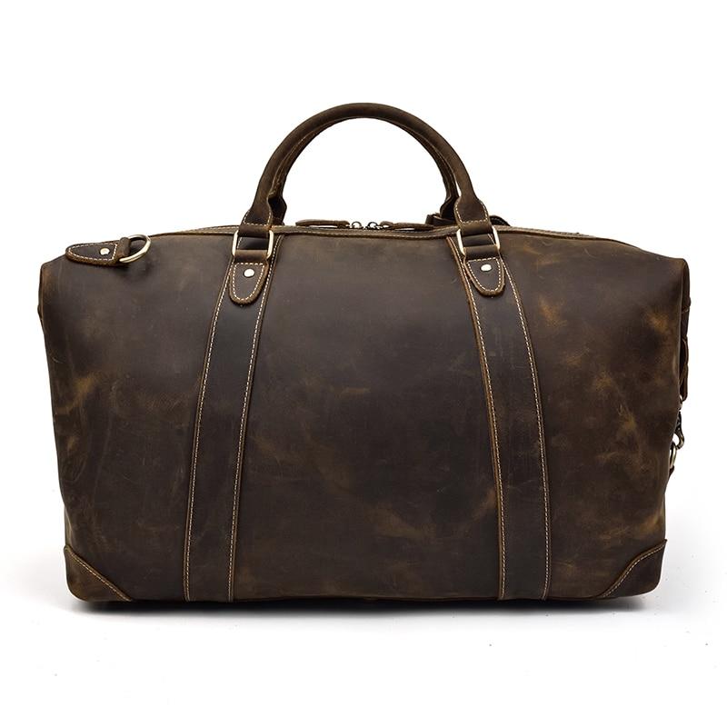 The Eira Duffle Bag made of premium crazy horse leather in two shades of brown, showcasing its spacious design and comfortable leather handles.