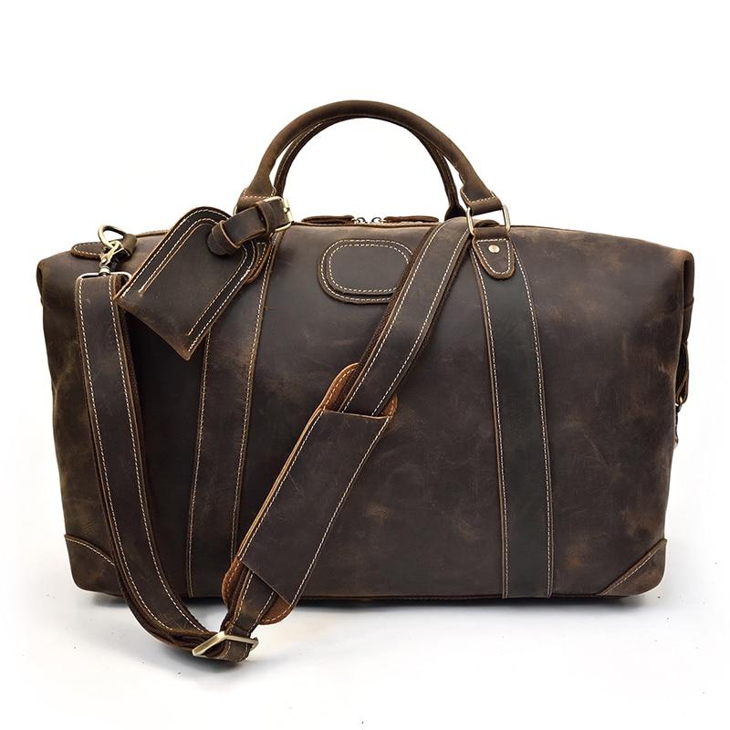 The Eira Duffle Bag made of premium crazy horse leather in two shades of brown, showcasing its spacious design and comfortable leather handles.