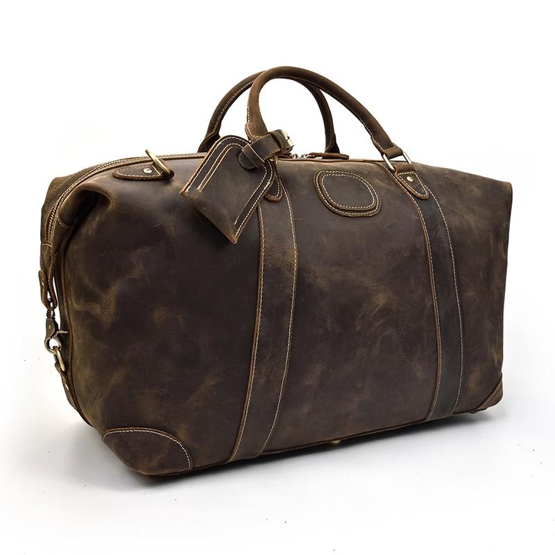 The Eira Duffle Bag made of premium crazy horse leather in two shades of brown, showcasing its spacious design and comfortable leather handles.