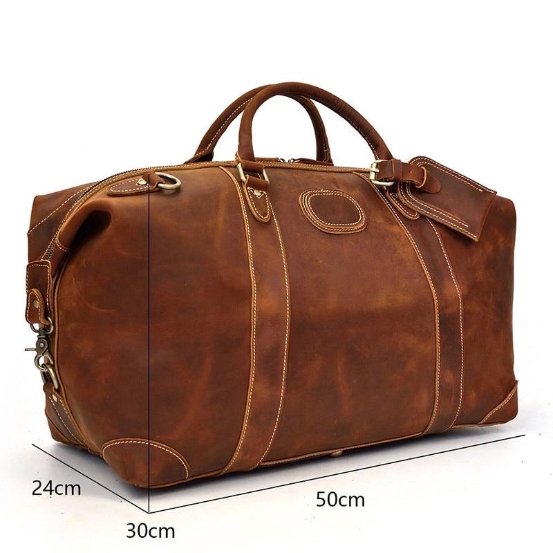 The Eira Duffle Bag made of premium crazy horse leather in two shades of brown, showcasing its spacious design and comfortable leather handles.