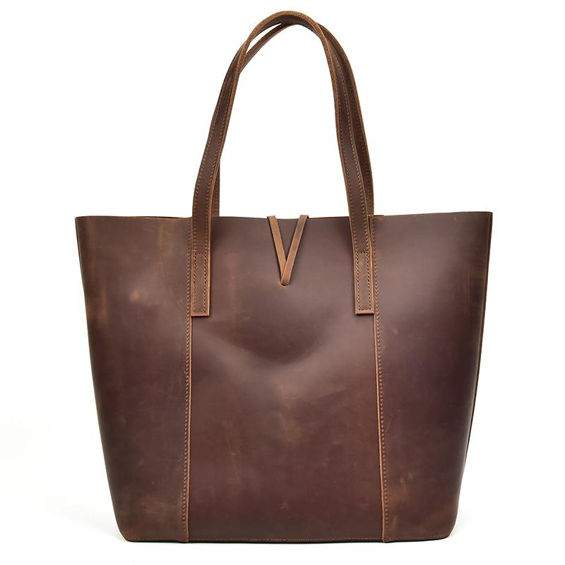The Taavi Tote, a handcrafted leather tote bag, showcasing its unique crazy horse leather texture and spacious design.