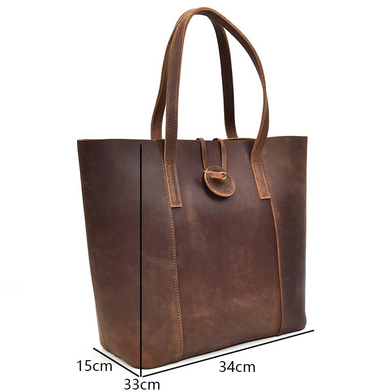 The Taavi Tote, a handcrafted leather tote bag, showcasing its unique crazy horse leather texture and spacious design.