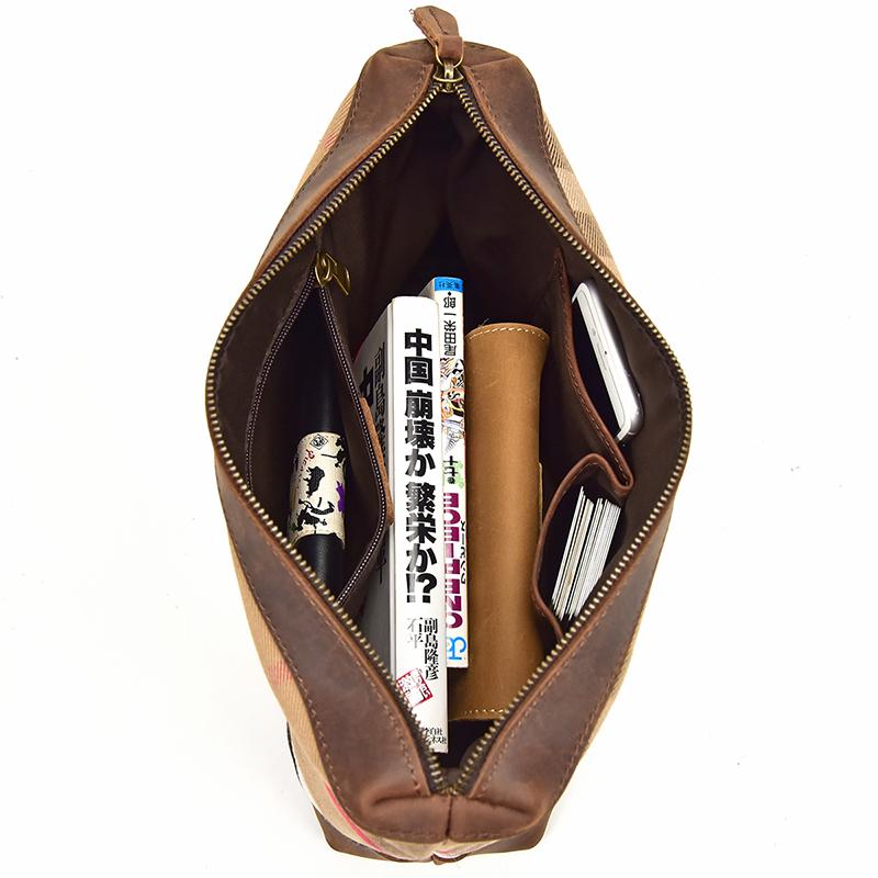 The Taavi Tote, a handcrafted leather tote bag, showcasing its unique crazy horse leather texture and spacious design.