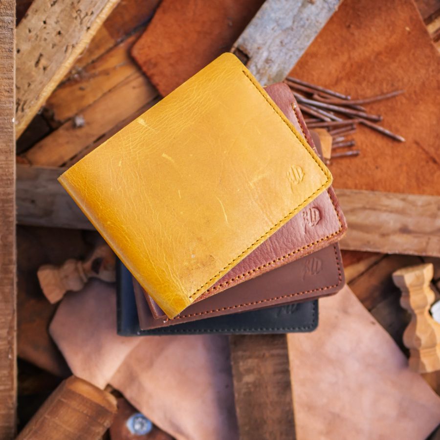 The Vault Vintage Leather Wallet in Arch-Wood Brown, showcasing its unique vintage wash and hand-pressed edges.