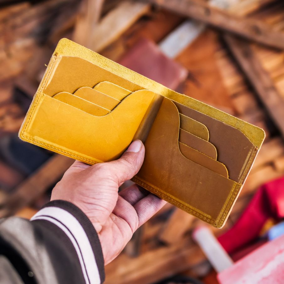 The Vault Vintage Leather Wallet in Arch-Wood Brown, showcasing its unique vintage wash and hand-pressed edges.