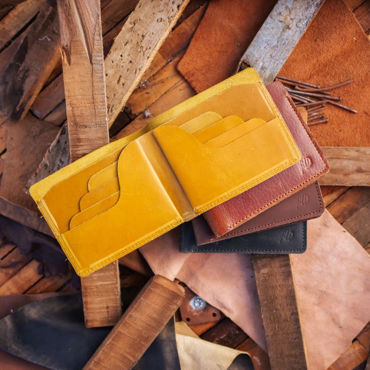 The Vault Vintage Leather Wallet in Arch-Wood Brown, showcasing its unique vintage wash and hand-pressed edges.