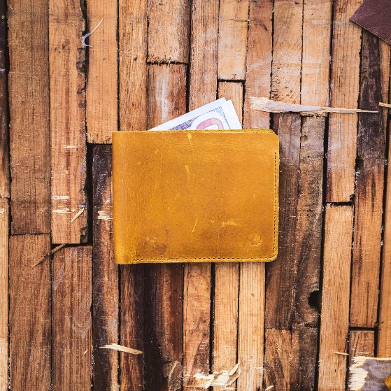 The Vault Vintage Leather Wallet in Arch-Wood Brown, showcasing its unique vintage wash and hand-pressed edges.