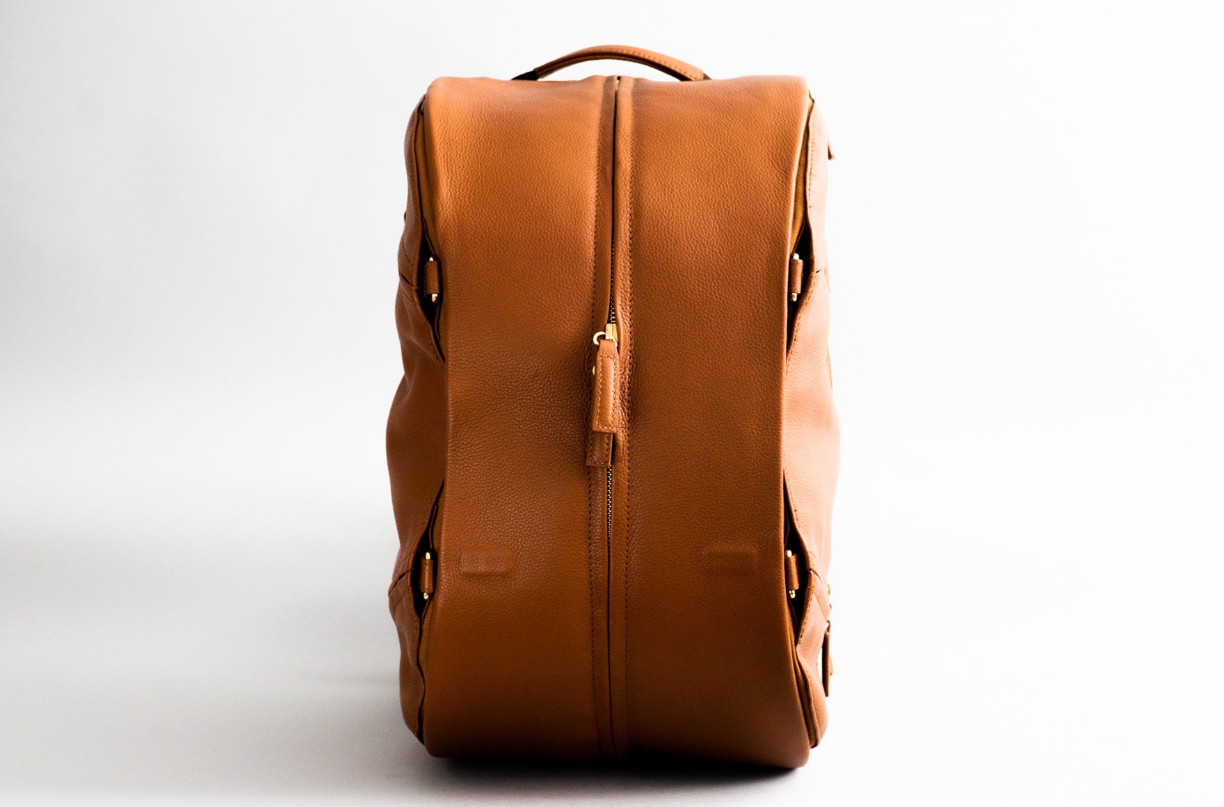 The Weekender Duffle Backpack in a stylish design, showcasing its three compartments and dual side access features.