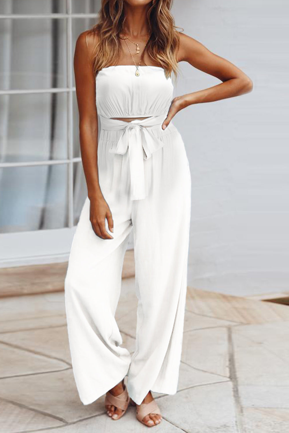 A stylish Tied Cutout Tube Wide Leg Jumpsuit featuring a tied design and wide leg cut, perfect for various occasions.