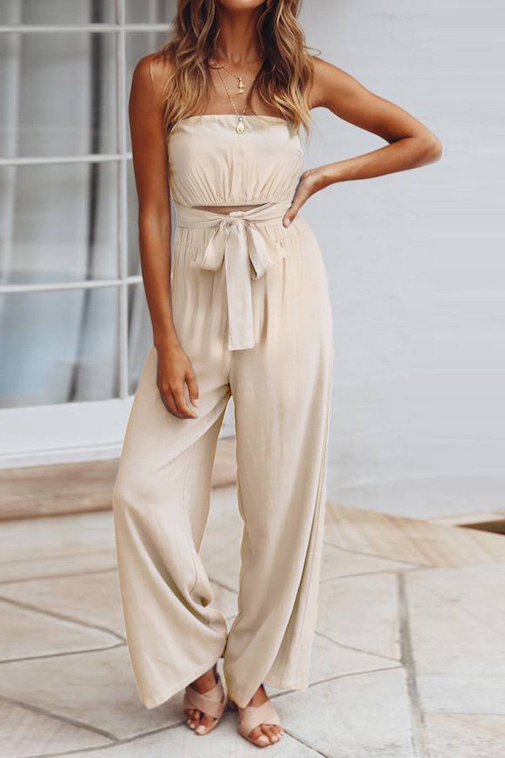 A stylish Tied Cutout Tube Wide Leg Jumpsuit featuring a tied design and wide leg cut, perfect for various occasions.