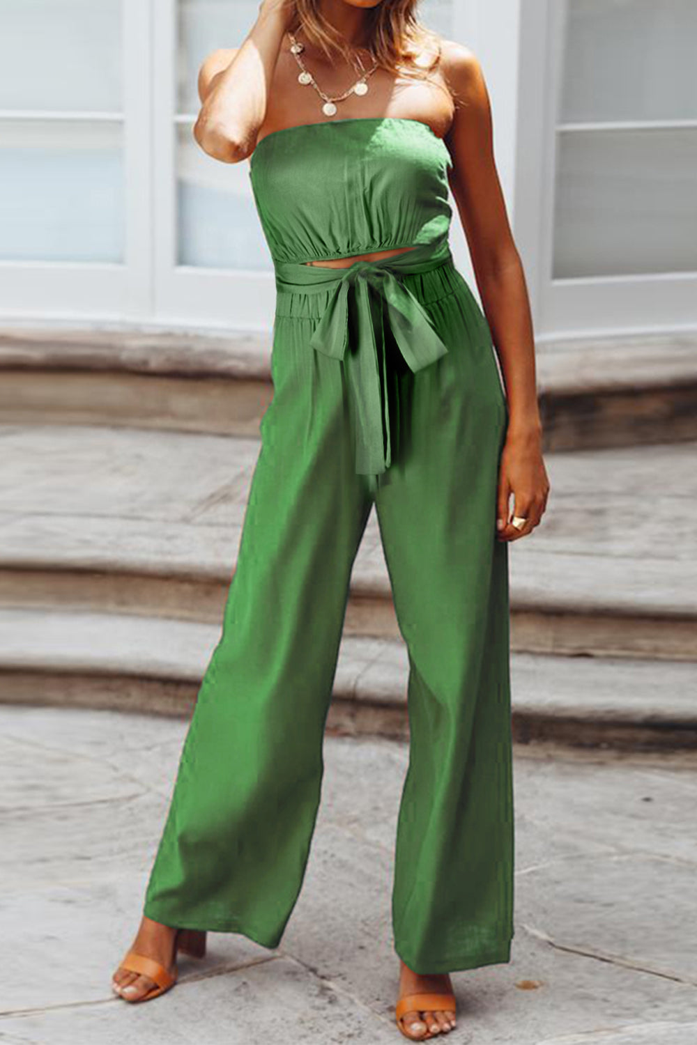 A stylish Tied Cutout Tube Wide Leg Jumpsuit featuring a tied design and wide leg cut, perfect for various occasions.