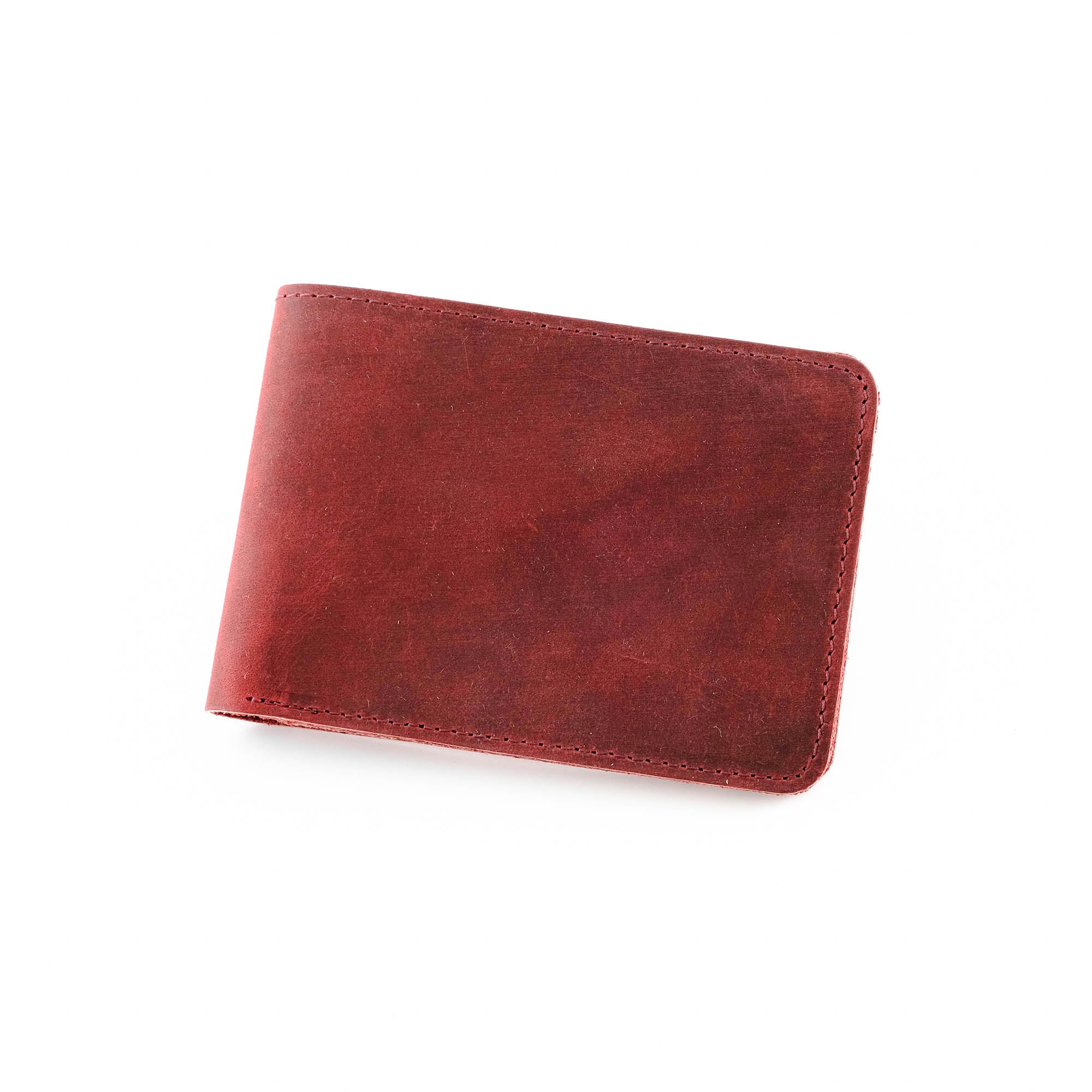Tulipa Genuine Leather Natural Wallet in four colors: Brown, Red, Blue, and Green, showcasing its sleek design and card slots.