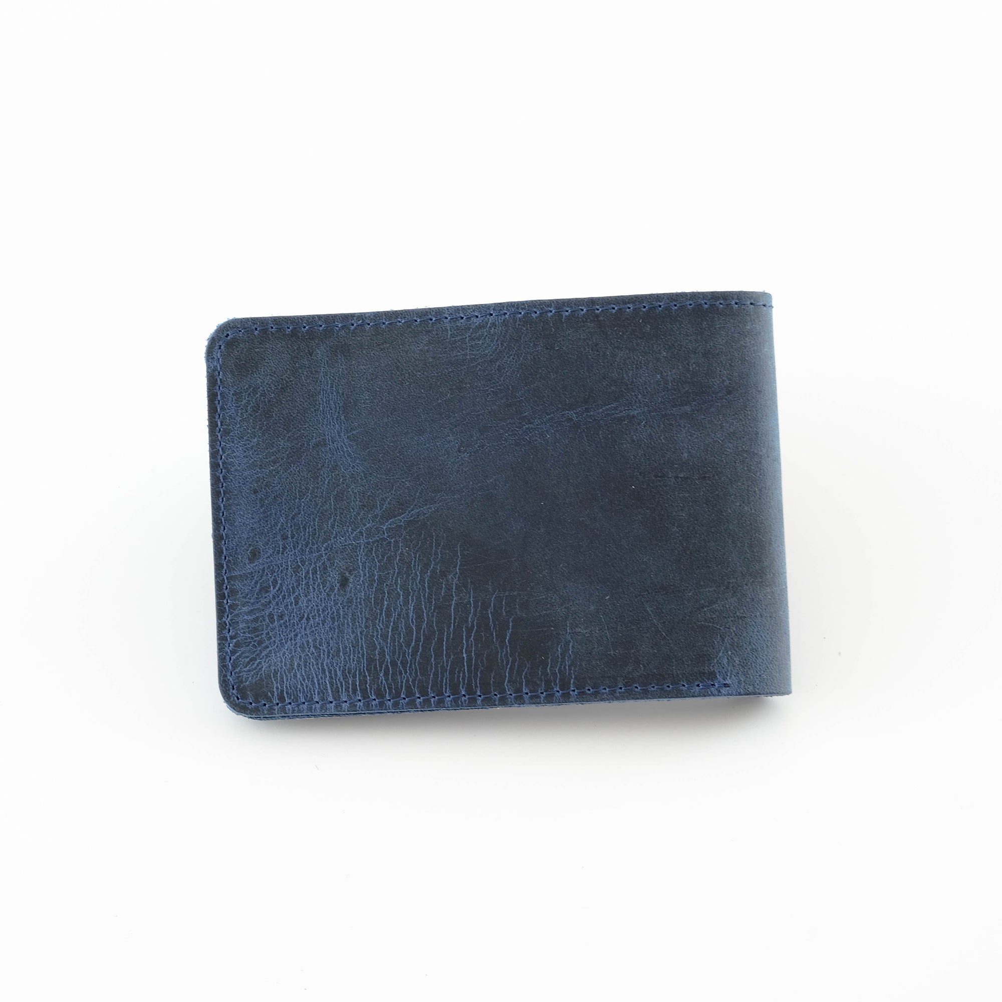 Tulipa Genuine Leather Natural Wallet in four colors: Brown, Red, Blue, and Green, showcasing its sleek design and card slots.