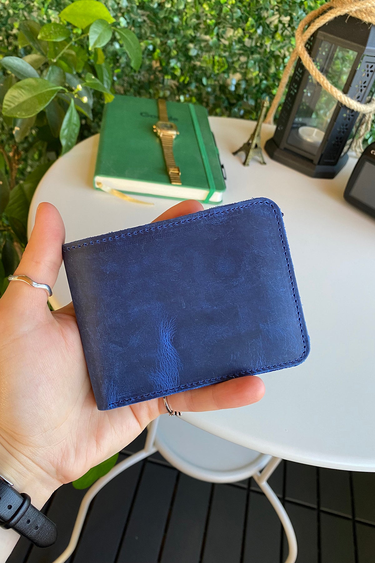 Tulipa Genuine Leather Natural Wallet in four colors: Brown, Red, Blue, and Green, showcasing its sleek design and card slots.