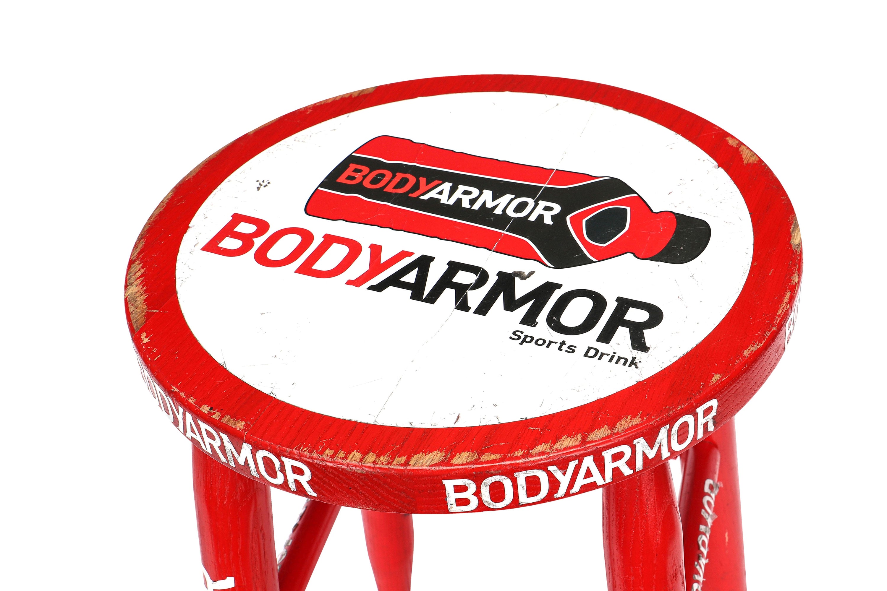 Used UFC corner stool from the Pavlovich vs. Blaydes event, featuring red color and signs of wear.