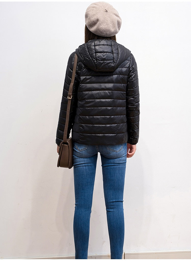 Ultra Light Women's Nylon Jacket in various colors, featuring a slim fit design, full sleeves, and zipper closure.