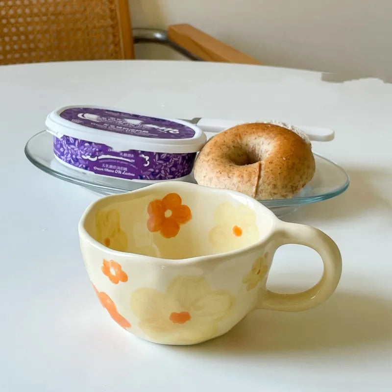 A beautifully designed Unique Floral Coffee Mug featuring vibrant floral patterns in pink, blue, orange, and purple colors, made from high-quality ceramic.