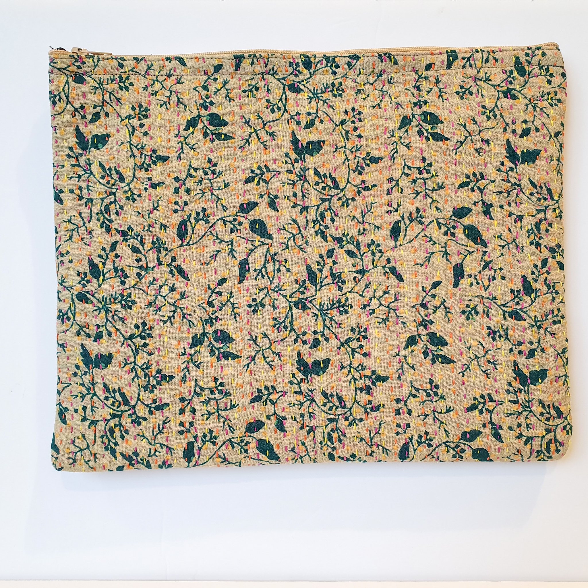 Upcycled sari clutch featuring vibrant colors and intricate kantha stitch embroidery, perfect for carrying essentials.