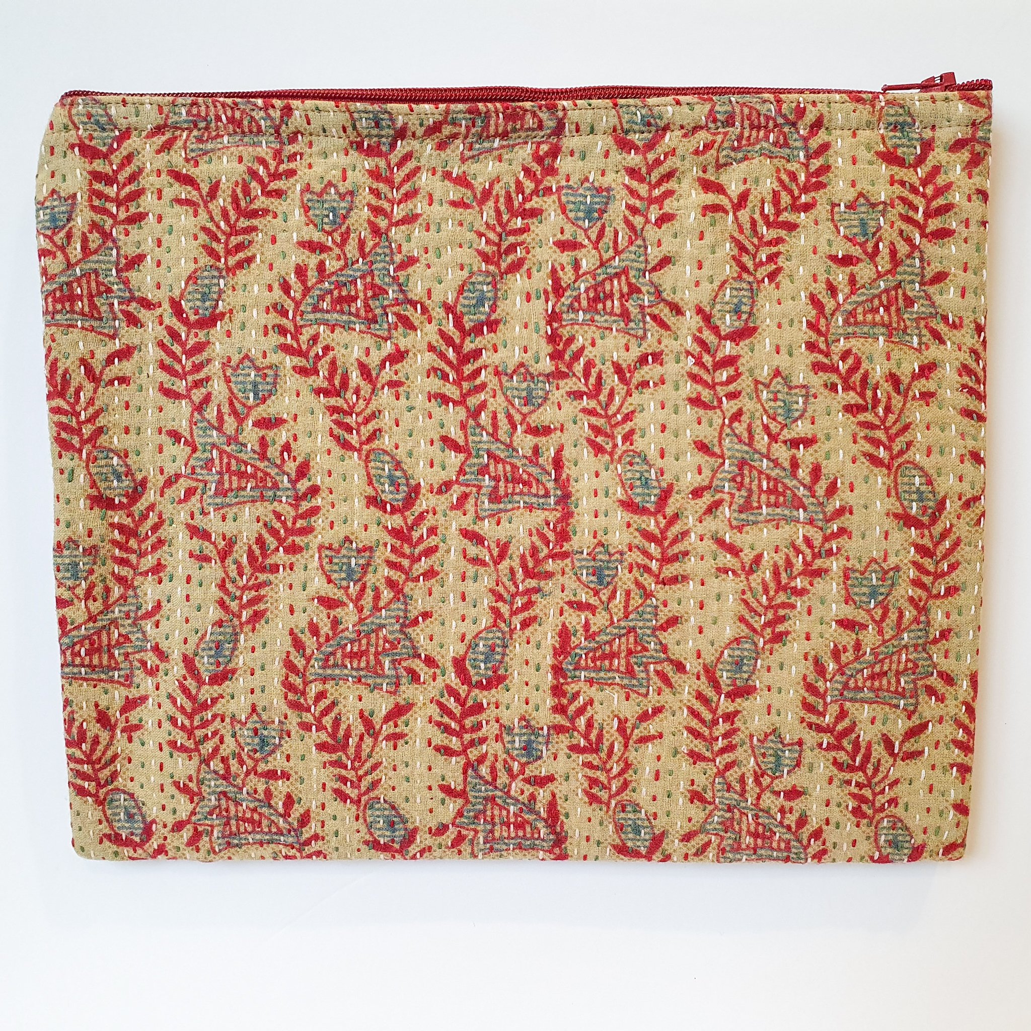 Upcycled sari clutch featuring vibrant colors and intricate kantha stitch embroidery, perfect for carrying essentials.
