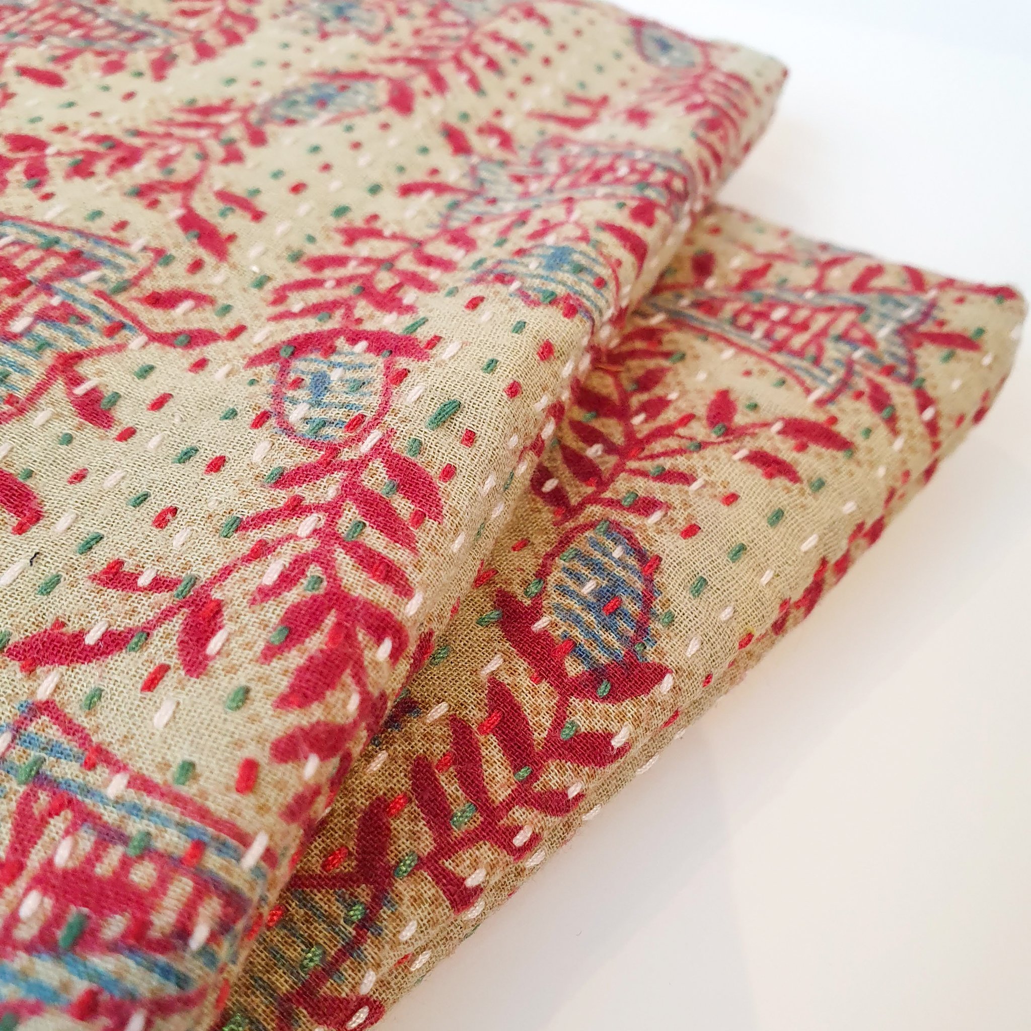 Upcycled sari clutch featuring vibrant colors and intricate kantha stitch embroidery, perfect for carrying essentials.