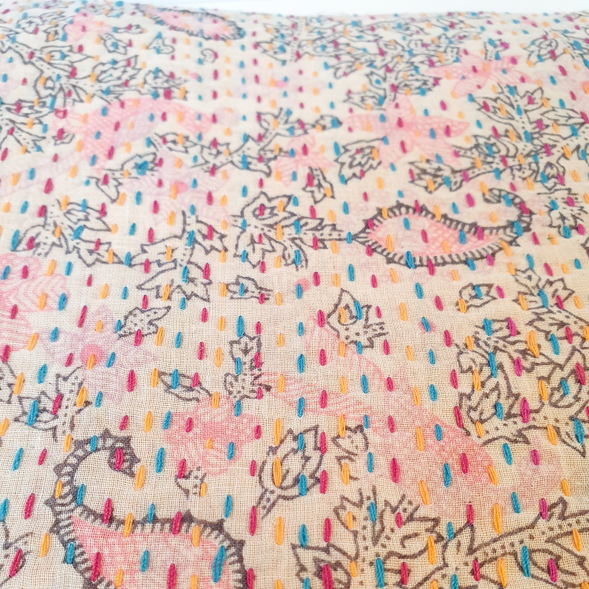 Upcycled sari clutch featuring vibrant colors and intricate kantha stitch embroidery, perfect for carrying essentials.