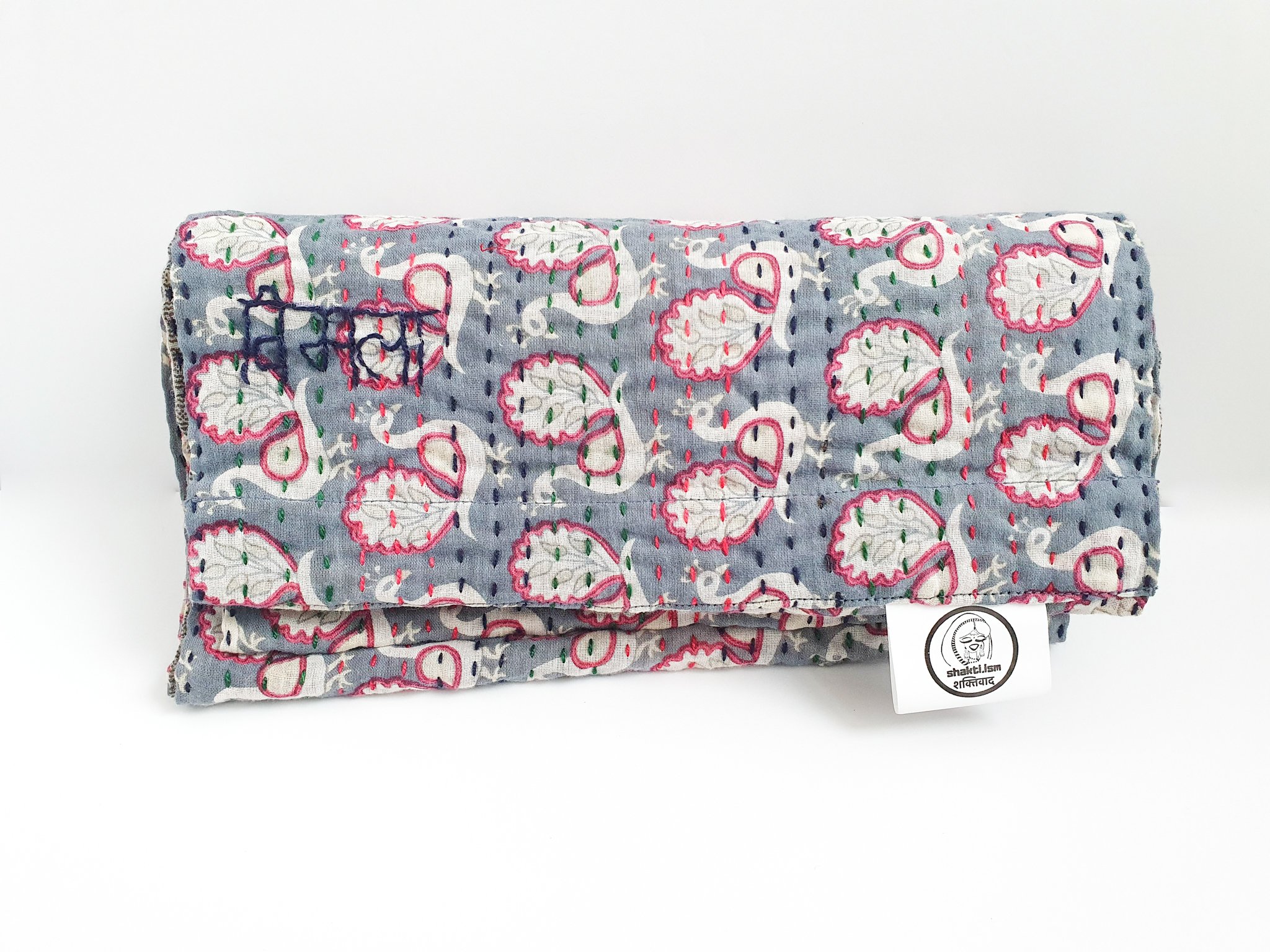 A vibrant upcycled sari cotton kantha infinity scarf showcasing unique patterns and colors, hand-stitched with traditional kantha technique.