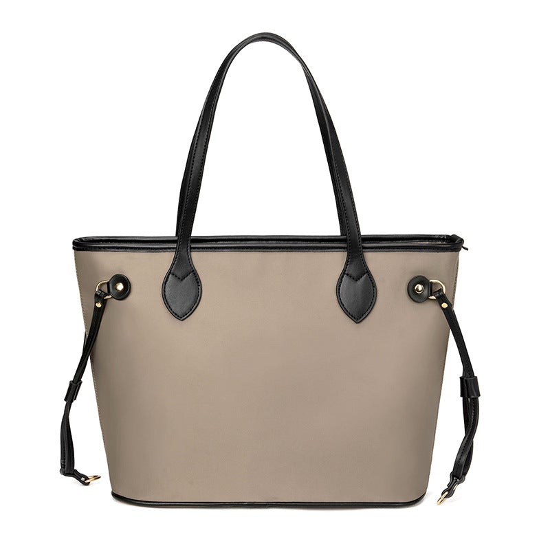 Vintage large capacity shoulder bag in grid-brown, showcasing its stylish design and spacious interior.