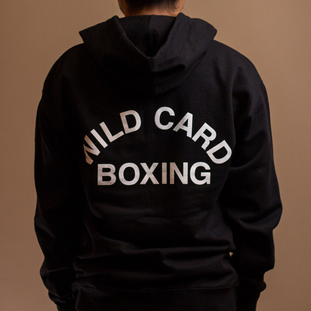 Black and white zip up hoodie featuring the Wild Card Boxing Old School logo, perfect for casual wear.