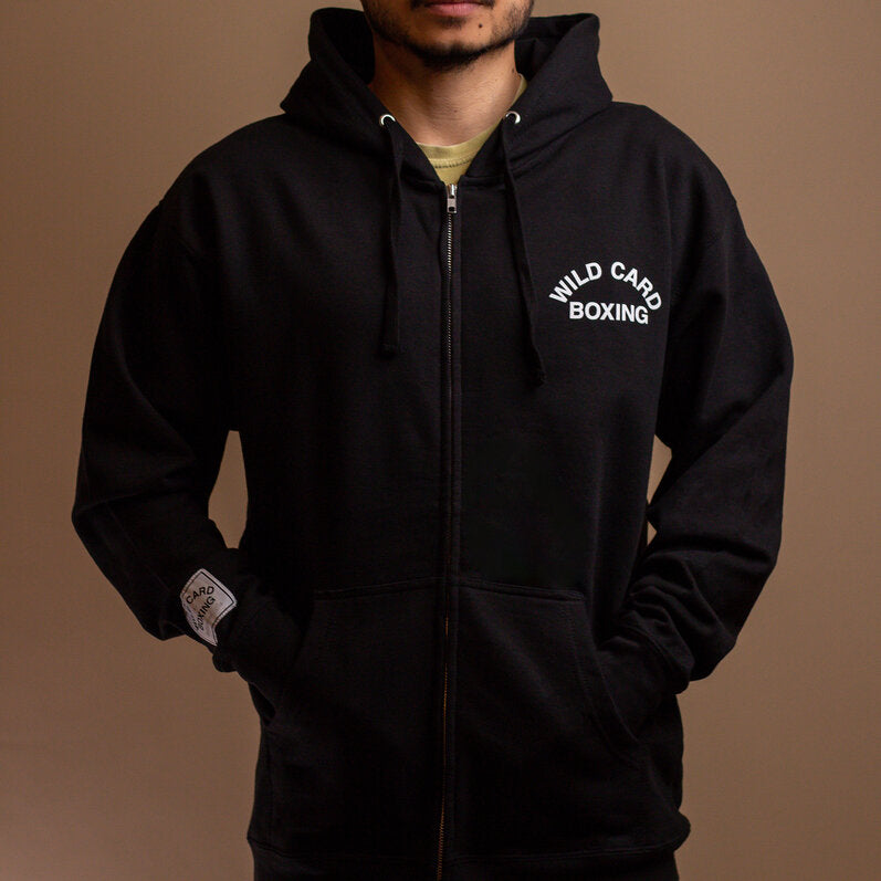 Black and white zip up hoodie featuring the Wild Card Boxing Old School logo, perfect for casual wear.