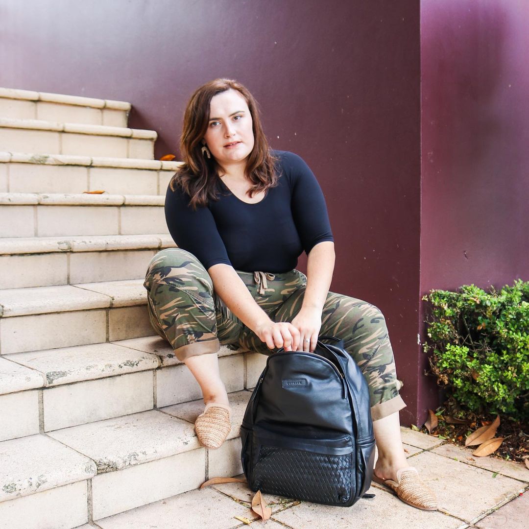 Weaved Journey Leather Backpack showcasing premium full grain leather, padded laptop compartment, and adjustable shoulder straps.
