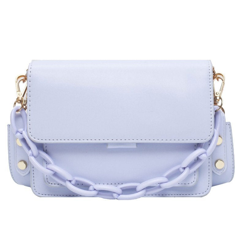 A fashionable small square bag for women in various colors including yellow, purple, black, light blue, and beige, featuring a stylish chain.
