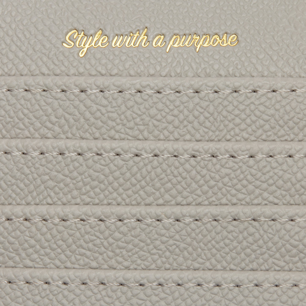 Willow Grey Coin and Card Holder made from 100% vegan leather, featuring a zipped compartment and four card slots, elegantly designed in a stylish grey color.