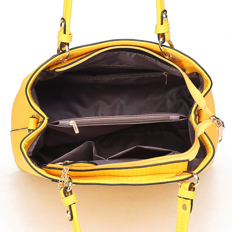 A stylish Women's Fashion Portable Three-Piece Bag Suit in yellow, black, and brown, showcasing its trendy design and practical features.