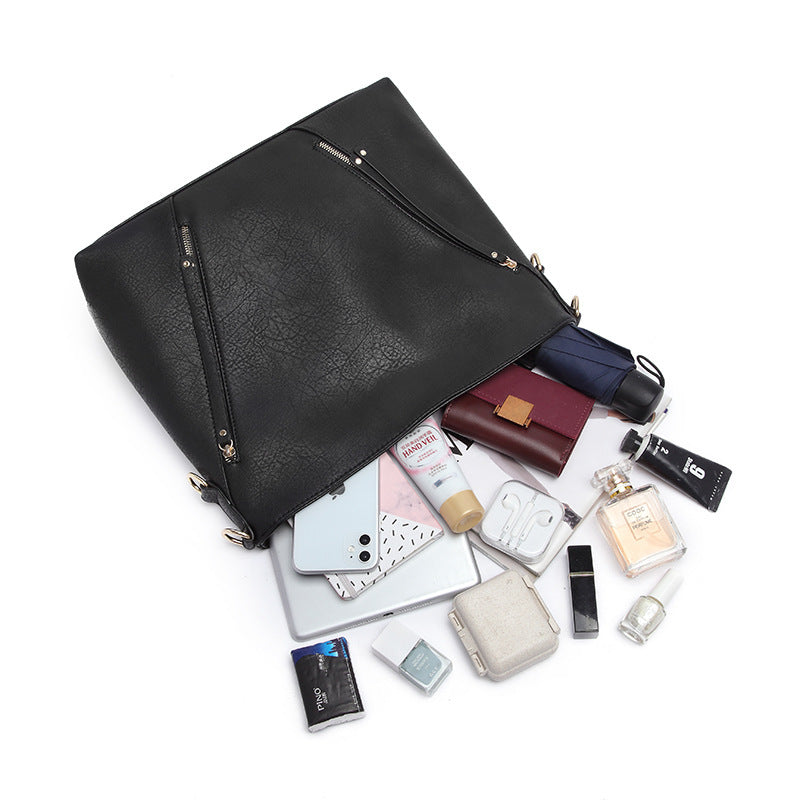 A stylish Women's High Quality Casual Large-capacity Messenger Bag made from durable PU material, featuring car suture detailing and an embossed pattern.