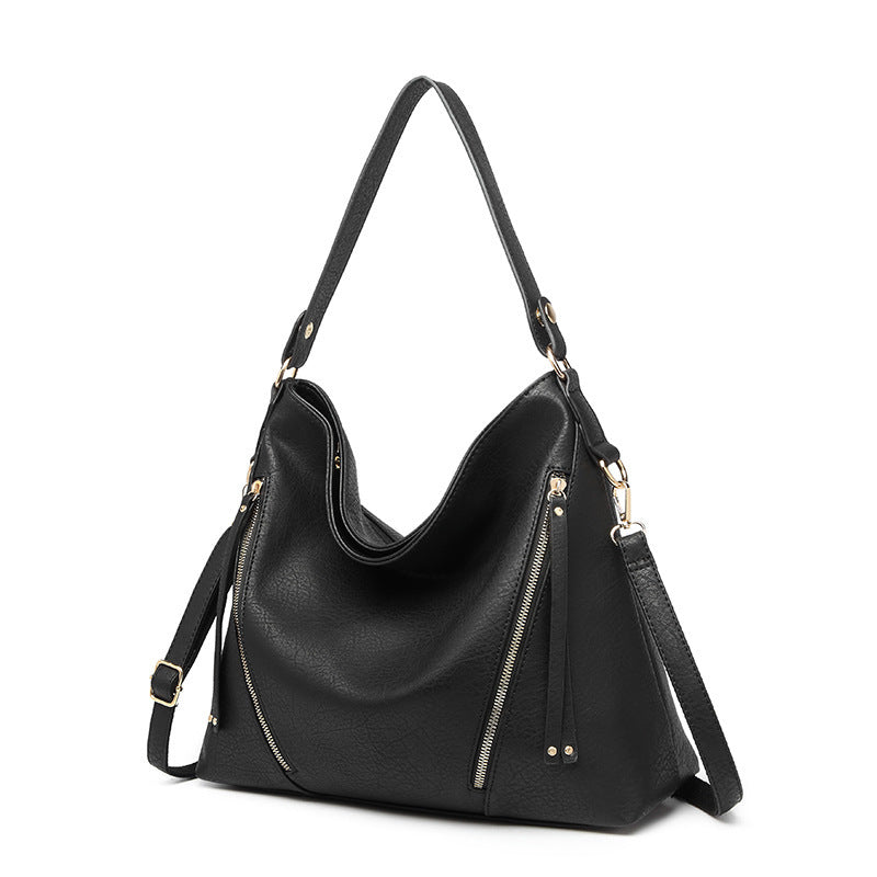 A stylish Women's High Quality Casual Large-capacity Messenger Bag made from durable PU material, featuring car suture detailing and an embossed pattern.