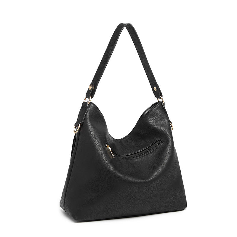 A stylish Women's High Quality Casual Large-capacity Messenger Bag made from durable PU material, featuring car suture detailing and an embossed pattern.