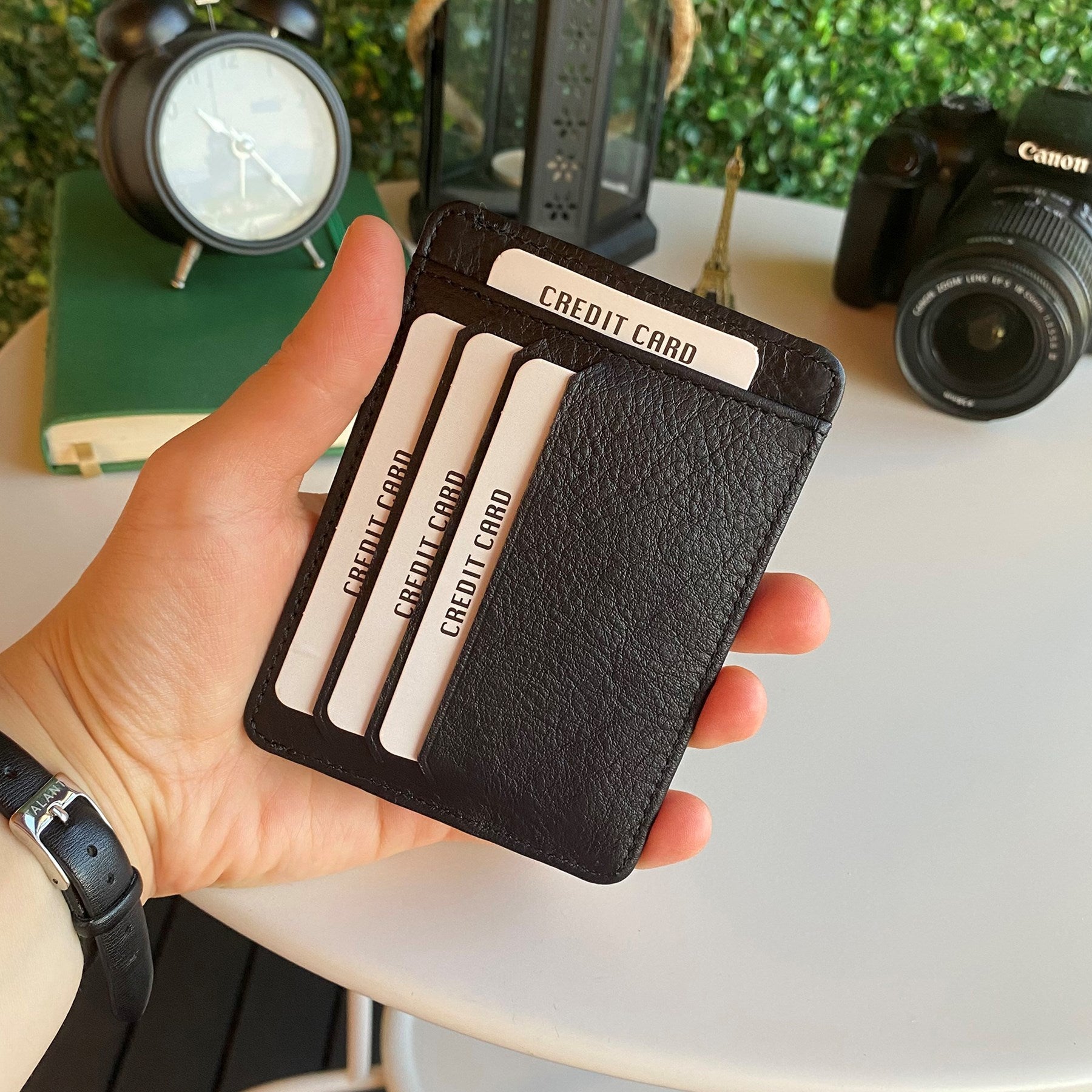 Zona Genuine Leather Card Holder showcasing its sleek design, ID window, and multiple card slots.