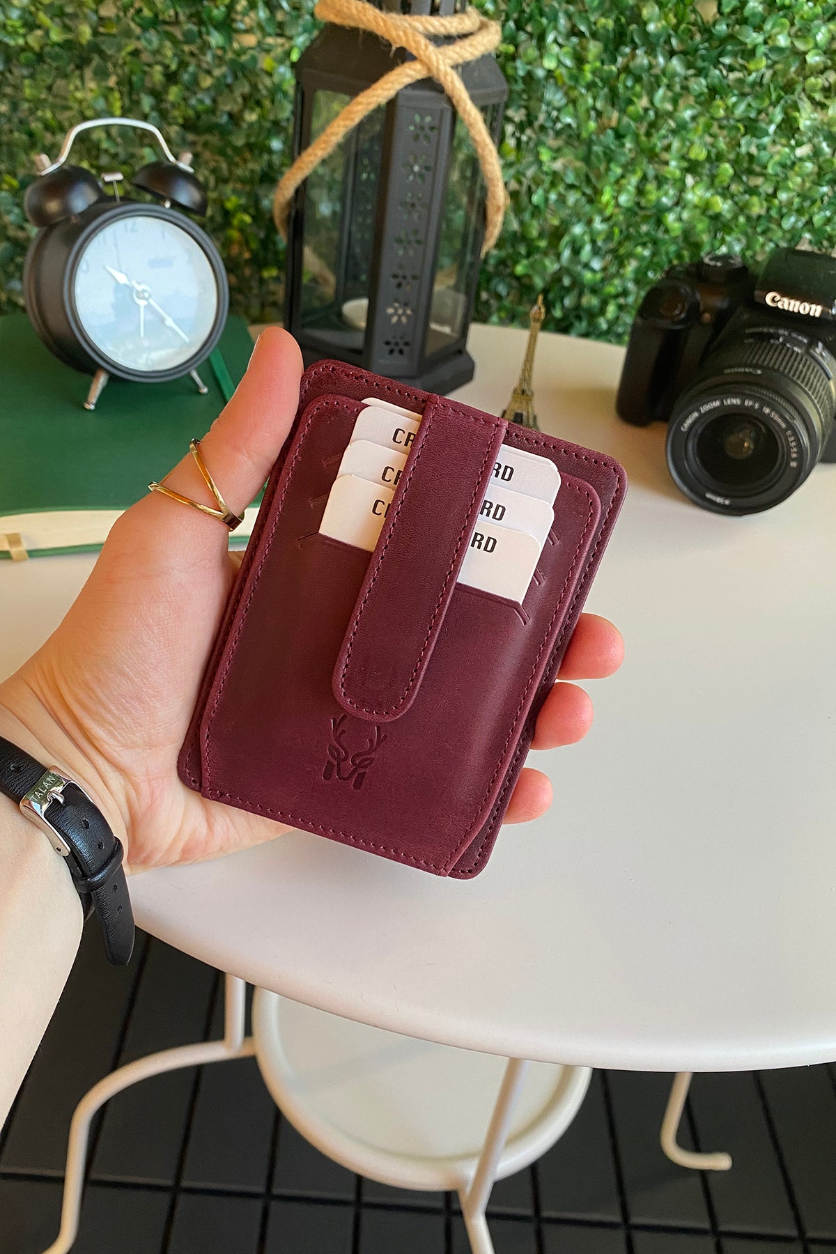 Zona Genuine Leather Card Holder showcasing its sleek design, ID window, and multiple card slots.