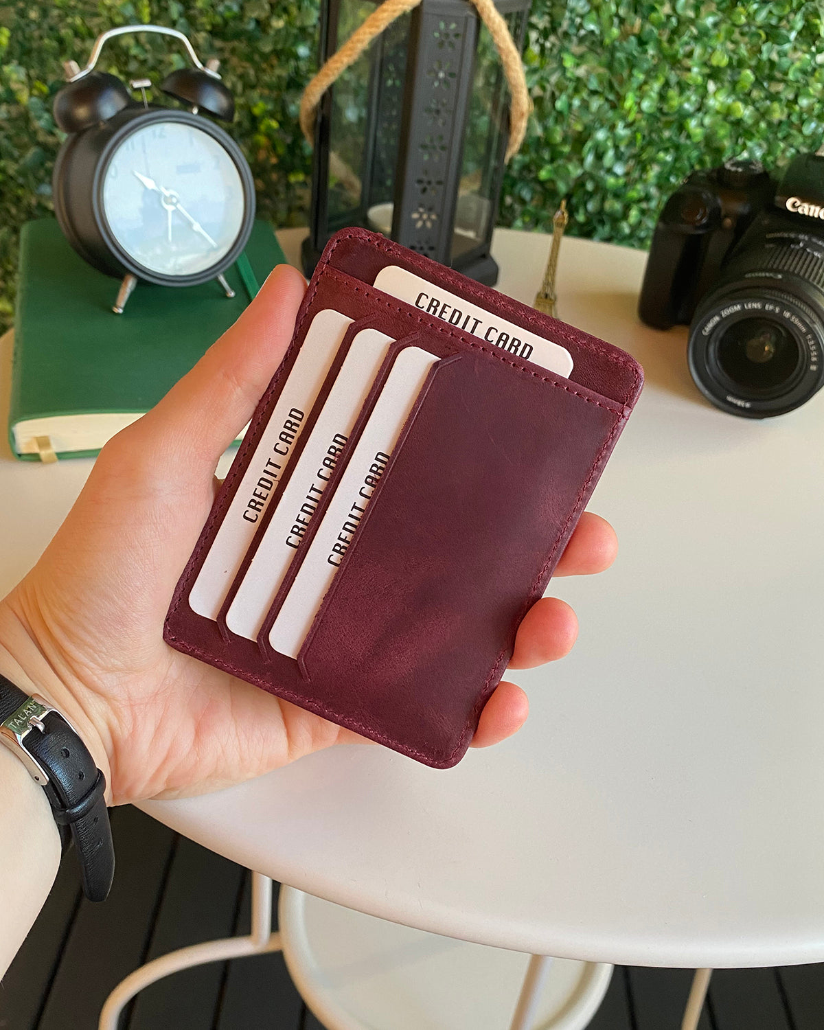 Zona Genuine Leather Card Holder showcasing its sleek design, ID window, and multiple card slots.